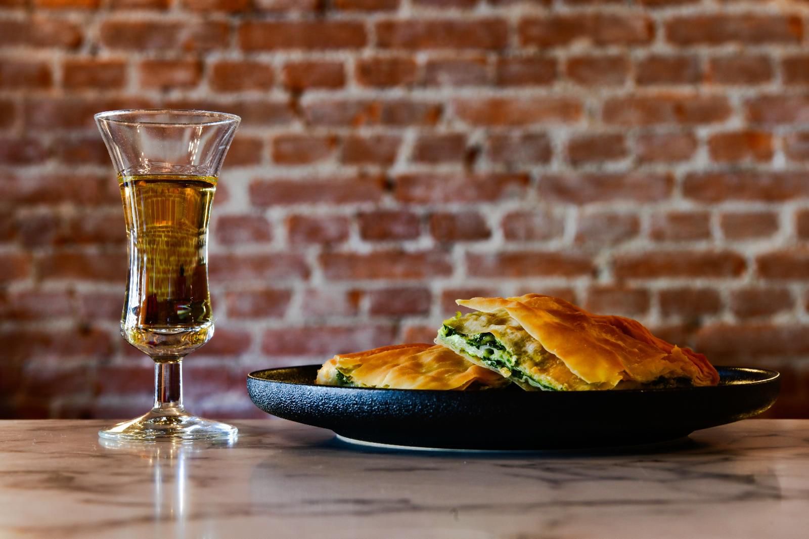 Albanian traditional meal Raki and Burek